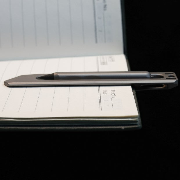 The BookBond Pen-Your Titanium Multitool Bookmark Companion