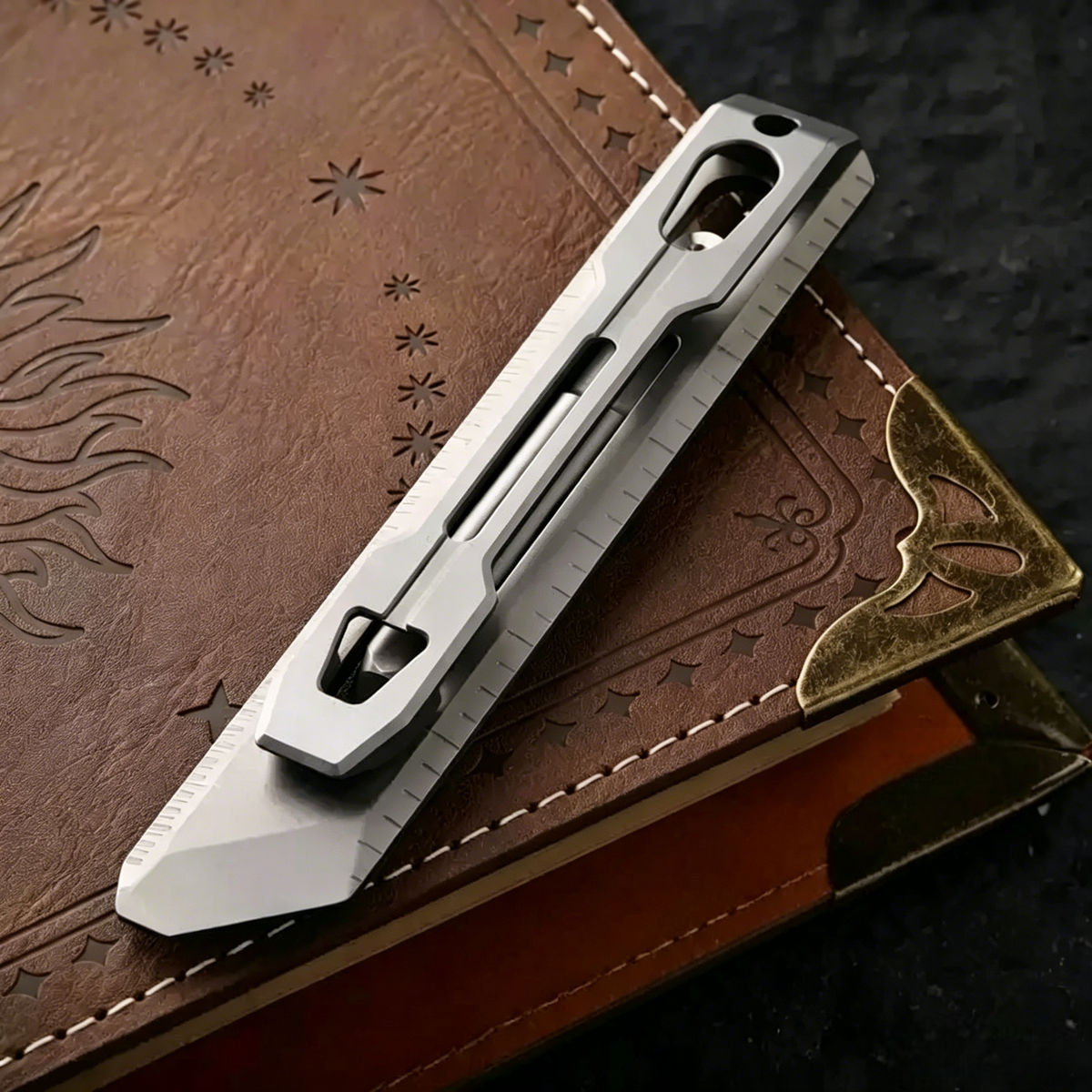 The BookBond Pen-Your Titanium Multitool Bookmark Companion