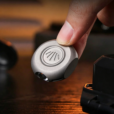 The MiCoin - Titanium Coin-Sized Rechargeable Flashlight
